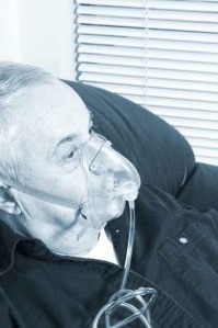 senior with oxygen mask in blue tone